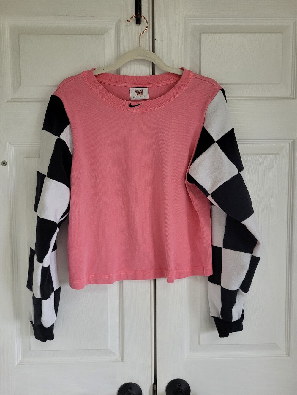 Nike Pink Sweatshirt with Black & White Checkerboard Sleeves
